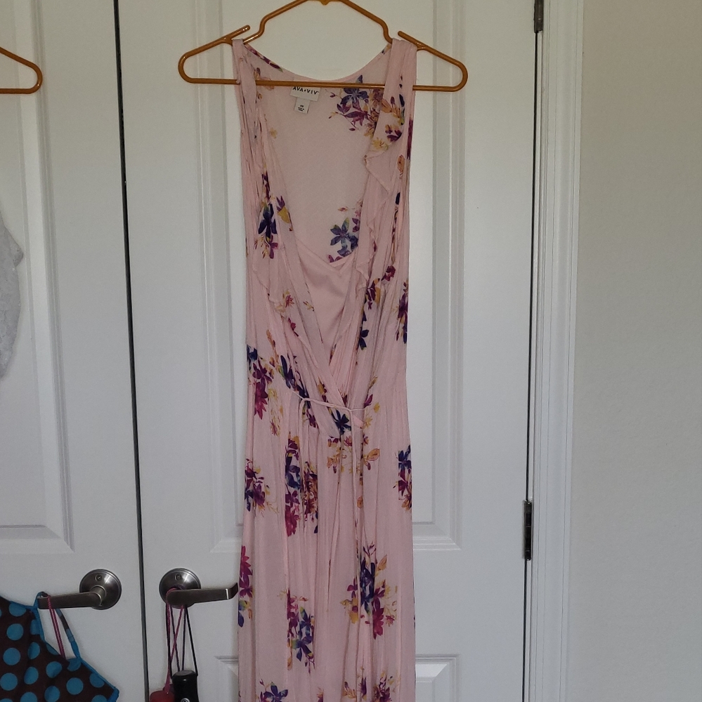 I'm selling a pink floral dress made by ava & viv and the size is a 3X.